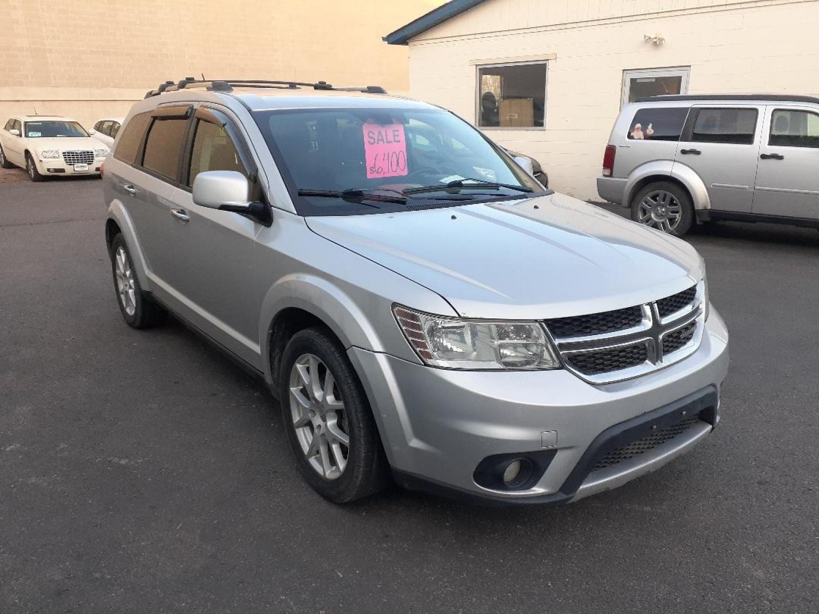 2013 Dodge Journey (3C4PDDFGXDT) with an 3.6L V6 DOHC 24V engine, 6-Speed Automatic transmission, located at 2015 Cambell Street, Rapid City, SD, 57701, (605) 342-8326, 44.066433, -103.191772 - CARFAX AVAILABLE - Photo #3